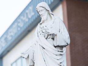 A statue of Jesus Christ looks down at the entrance to Regina Catholic School Division’s Sacred Heart School in Regina on Jan. 11, 2018.