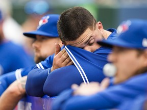 Alek Manoah of the Toronto Blue Jays wipes his brow in the dugout after getting pulled in the first inning against the Houston Astros at the Rogers Centre on June 5, 2023.