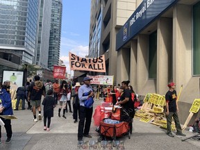 Decent work and equal rights for all. That was the message Sunday from dozens of protesters in Toronto. (Kevin Connor/Toronto Sun)