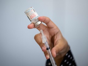 A medical staff member prepares a syringe with a vial of the Moderna COVID-19 vaccine at a pop up vaccine clinic in the Jewish Community Center on April 16, 2021 in the Staten Island borough of New York City.