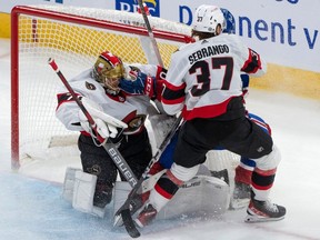 The Montreal Canadiens' Emil Heineman is called on goaltender interference on Ottawa Senators goaltender Joonas Korpisalo as Donovan Sebrango defends during second period NHL preseason action in Montreal, Wednesday, Sept. 27, 2023.