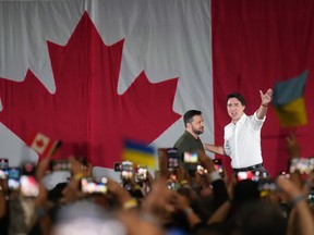 Prime Minister Justin Trudeau introduces Ukrainian President Volodymyr Zelenskyy at a rally at the Fort York Armoury in Toronto on Friday, September 22, 2023.