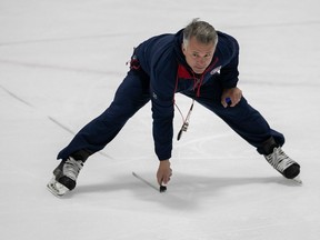 Canadiens head coach Martin St-Louis draws a line on ice during a training-camp practice last month in Brossard.