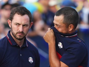Patrick Cantlay and Xander Schauffele of Team United States talk following the Sunday singles matches of the 2023 Ryder Cup at Marco Simone Golf Club on Oct. 1, 2023 in Rome, Italy.