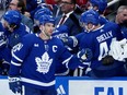 Toronto Maple Leafs centre John Tavares (91) celebrates his goal with teammates on the bench.