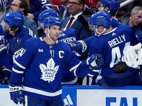 Toronto Maple Leafs centre John Tavares (91) celebrates his goal with teammates on the bench.