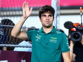 Lance Stroll and Aston Martin F1 Team waves to the crowd on the drivers parade prior to the F1 Grand Prix of Qatar.