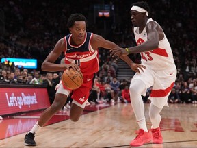 Washington Wizards' Bilal Coulibaly (left) drives past Toronto Raptors' Pascal Siakam during first half pre-season NBA basketball action in Toronto on Oct. 20, 2023.