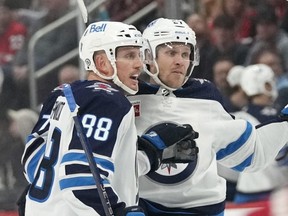 Winnipeg Jets left wing Nikolaj Ehlers (right), celebrates his goal with teammate Nate Schmidt during the first period of the Jets' 4-1 victory over the Detroit Red Wings on Oct. 26, 2023, in Detroit.