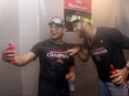 Gabriel Moreno and Lourdes Gurriel Jr. of the Arizona Diamondbacks celebrate in the clubhouse.