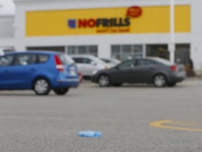 Litter the parking lot at a No Frills grocery store on Island Rd., near Port Union Rd. and Hwy. 401, in Scarborough on Wednesday, March 25, 2020.