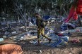 An Israeli soldier patrols on Oct. 12, 2023 near Kibbutz Beeri, the place where 270 revellers were killed by militants during the Supernova music festival on Oct. 7.