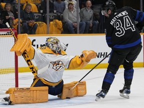 Nashville Predators goaltender Juuse Saros makes a save on Maple Leafs centre Auston Matthews on Saturday night. AP