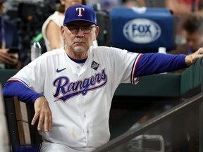 Texas Rangers manager Bruce Bochy looks on from the dugout prior to Game 1 of the World Series against the Arizona Diamondbacks at Globe Life Field. This is his fifth World Series in 26 years as a manager.