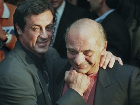 Sylvester Stallone, left, mugs with "Rocky" co-star Burt Young before a screening of the 1976 film to celebrate its 20th anniversary, Nov. 15, 1996, in Beverly Hills, Calif.