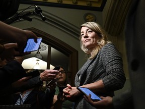 Foreign Affairs Minister Melanie Joly speaks to reporters as she arrives for a meeting of the federal cabinet on Parliament Hill in Ottawa on Tuesday, Oct. 3, 2023.