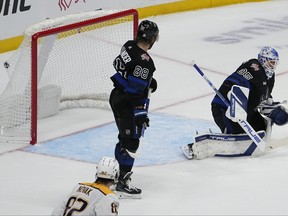 Maple Leafs goaltender Ilya Samsonov cannot prevent Roman Josi from wiring an overtime shot past him in Nashville on Saturday as teammate William Nylander looks on. The Predators won 3-2.