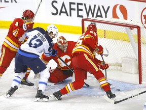 Calgary Flames goalie Jacob Markstrom battles Winnipeg Jets Gabriel Vilardi in the first period of the home opener at the Scotiabank Saddledome in Calgary on Wednesday, October 11, 2023.