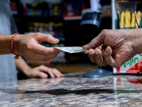A customer purchases a Powerball lottery ticket.