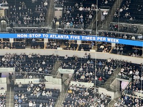 In a not-so-subtle touch of irony, empty seats surround a banner message advertising flights from Winnipeg to Atlanta, the former home of the Jets on Tuesday night.