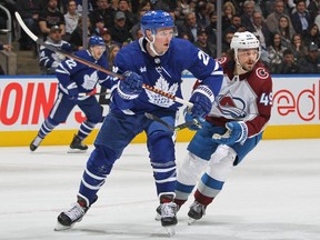 Samuel Girard of the Colorado Avalanche skates against Sam Lafferty of the Toronto Maple Leafs during an NHL game at Scotiabank Arena on March 15, 2023 in Toronto.