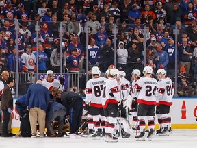 Medical staff attend to Erik Brannstrom of the Ottawa Senators after he was checked by Cal Clutterbuck of the New York Islanders during the second period at UBS Arena on Oct. 26, 2023 in Elmont, N.Y.