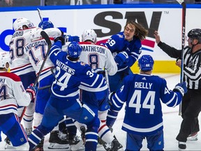 Toronto Maple Leafs Tyler Bertuzzi and Auston Matthews during a tussle with the Montreal Canadiens in 3rd period action during the home opener at the Scotiabank Arena in Toronto on Wednesday October 11, 2023.