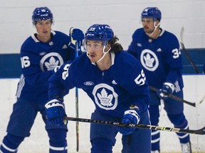 The Toronto Maple Leafs' Tyler Bertuzzi, front, Mitch Marner, left, and Auston Matthews take the ice during training camp at the Ford Performance Centre in Etobicoke on Thursday, Sept. 21, 2023.