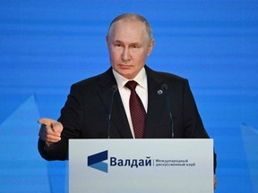 This pool photograph distributed by Russian state owned agency Sputnik shows Russian President Vladimir Putin addressing the plenary session of the Valdai Discussion Club forum in Sochi, Thursday, Oct. 5, 2023.