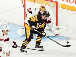 Pittsburgh Penguins' Sidney Crosby is stopped by Ottawa Senators goaltender Joonas Korpisalo during third period NHL preseason hockey action in Halifax on Monday, Oct. 2, 2023.