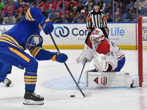 Montreal Canadiens goalie Jake Allen, right, defends against Buffalo Sabres left wing Jeff Skinner during the second period of an NHL hockey game in Buffalo, N.Y., Monday, Oct. 23, 2023.