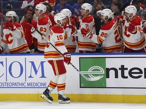 Calgary Flames center Jonathan Huberdeau (10) celebrates after his goal during the first period of an NHL hockey game against the Buffalo Sabres, Thursday, Oct. 19, 2023, in Buffalo, N.Y.