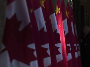 Global Affairs Canada says a social media campaign&ampnbsp;connected to the People's Republic of China is targeting dozens of Canadian members of Parliament, including the prime minister, with spam. A Chinese flag is illuminated by sunshine in the Hall of Honour, in Ottawa, Thursday, Sept. 22, 2016.