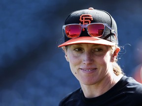 FILE - San Francisco Giants assistant coach Alyssa Nakken speaks to a reporter in San Francisco, July 7, 2023. President of Baseball Operations Farhan Zaidi confirmed on Sunday, Oct. 15, 2023, that Nakken, has interviewed for the Giants managerial vacancy and had gone through a first-round interview last week.