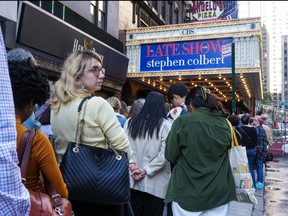 Audience members line up outside of "The Late Show With Stephen Colbert" on Oct. 2, 2023 in New York City.