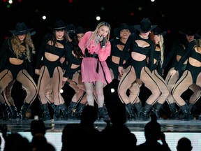 Pop icon Madonna performs onstage with Colombian singer Maluma (out of frame) during his concert "Medallo in the Map" in Medellin, Colombia, on April 30, 2022.