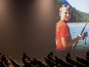 A photo of Carson Crimeni is projected on a wall as people listen during a celebration of life for the late 14-year-old in Langley, B.C., on Thursday August 29, 2019. A man has been sentenced to 18 months in jail with another 18 months of conditional supervision after pleading guilty to manslaughter in the high-profile overdose death of Carson Crimeni in Metro Vancouver four years ago.