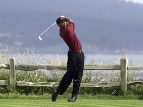 FILE - Tiger Woods drives the 18th hole on his way to winning the 100th U.S. Open Golf Championship at the Pebble Beach Golf Links in Pebble Beach, Calif., on June 18, 2000. A 60-foot birdie putt sunk on the 18th at St. Andrew's before a playoff loss to John Daly at the 1995 British Open. A front-row seat to history paired with Tiger Woods in the final round of the 1997 Masters. Then a career-defining singles win over Woods later in '97 that helped Europe win the Ryder Cup. It's been nearly three decades since Costantino Rocca put Italian golf on the map and it's hard to imagine the Ryder Cup being held near Rome this week would have happened without him.