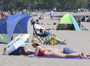Enjoy it while it lasts – because above-normal temperatures are expected to dominate for the rest of October. Pictured, are people taking in the sunny weather at Woodbine Beach in Toronto on May 29, 2022.