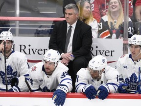 Toronto Maple Leafs head coach Sheldon Keefe looks on from the bench during a game.