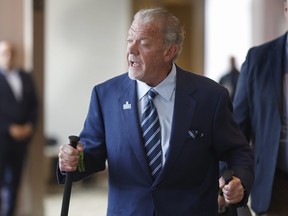 Indianapolis Colts owner Jim Irsay leaves after attending a special meeting to vote on the sale of the Washington Commanders in 2023.