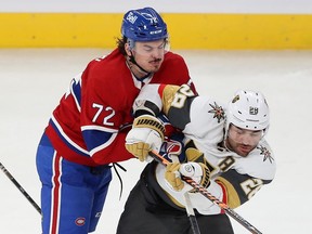 Montreal Canadiens' Arber Xhekaj (72) collides at mid ice with Vegas Golden Knights' William Carrier (28) during second period NHL action in Montreal on Thursday Nov. 16, 2023.
