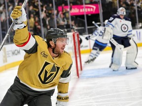 LAS VEGAS, NEVADA - NOVEMBER 02: Jonathan Marchessault #81 of the Vegas Golden Knights celebrates his second-period power-play goal against Connor Hellebuyck #37 of the Winnipeg Jets during their game at T-Mobile Arena on November 02, 2023 in Las Vegas, Nevada. (Photo by Ethan Miller/Getty Images)