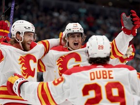 Calgary Flames forward Martin Pospisil (76) celebrates his first NHL goal in his debut against the Seattle Kraken at Climate Pledge Arena in Seattle on Saturday, Nov. 4, 2023.
