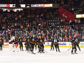 The Calgary Flames salute the crowd after defeating the Vancouver Canucks during an NHL game at Scotiabank Saddledome on November 16, 2023 in Calgary, Alberta, Canada. The Flames defeated the Canucks 5-2.