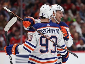 Ryan Nugent-Hopkins #93 of the Edmonton Oilers celebrates his goal with teammate Zach Hyman #18 against the Washington Capitals during the first period at Capital One Arena on November 24, 2023 in Washington, DC.
