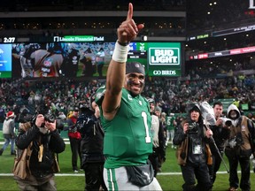 Jalen Hurts of the Philadelphia Eagles celebrates after his team's 37-34 overtime win against the Buffalo Bills at Lincoln Financial Field on Sunday, Nov. 26, 2023, in Philadelphia.