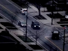 A 2022 Mercedes G Wagon that was stolen in a gunpoint carjacking in Brampton is seen in video captured from a police helicopter barrelling through traffic, and stop signs, before the driver takes off on foot in Toronto.