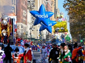 Revellers take part in the 96th-annual Macys Thanksgiving Day Parade on November 24, 2022 in New York City.