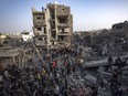 Palestinians look for survivors of the Israeli bombardment in the Maghazi refugee camp in the Gaza Strip, Sunday, Nov. 5, 2023.
